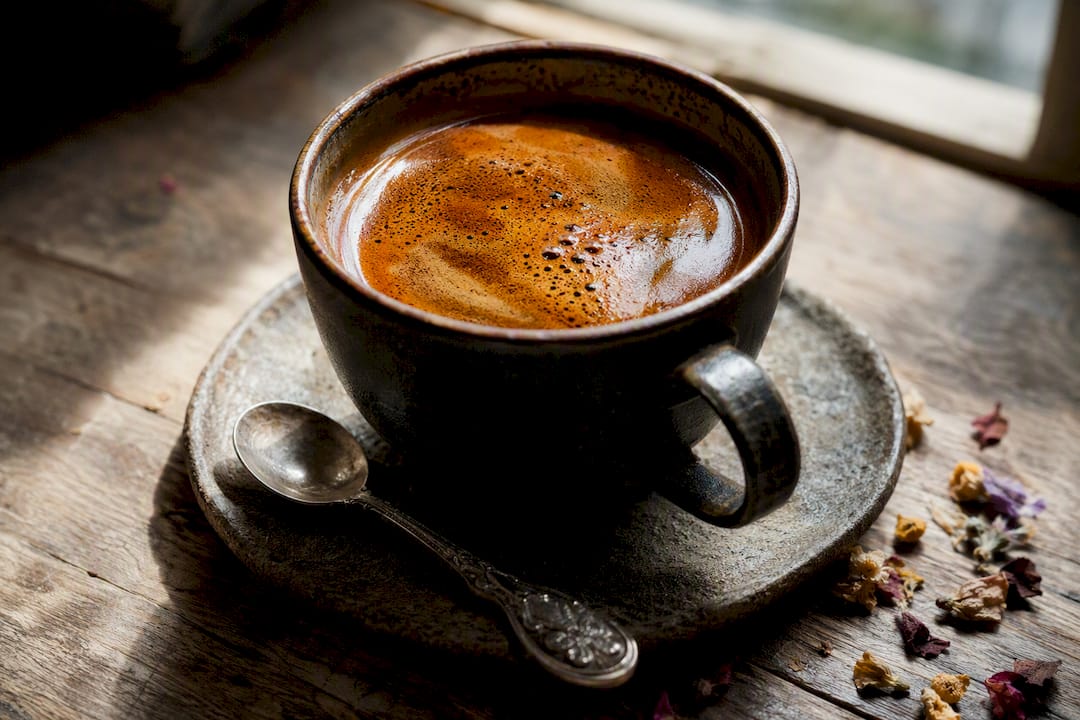 Cup of carbonic maceration coffee with reddish hue