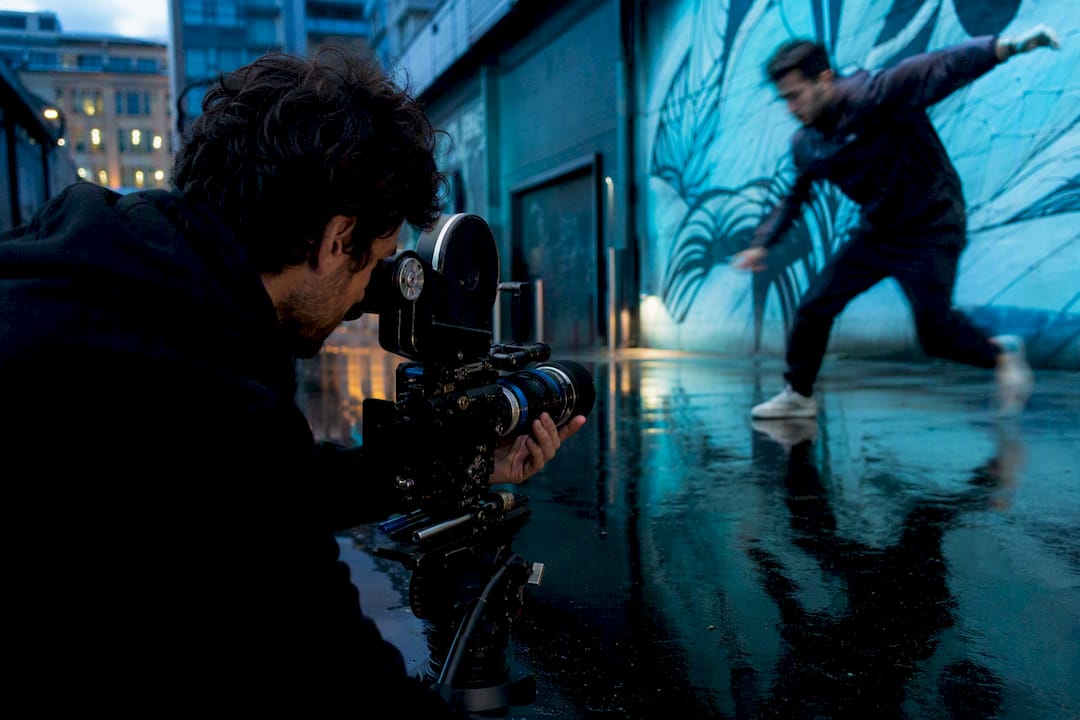 Cinematographer adjusting camera mid-motion shot