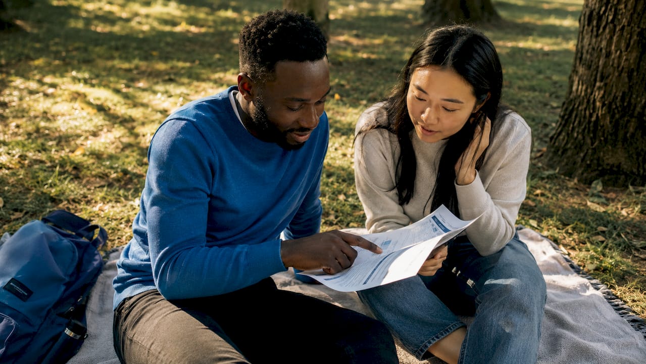 Two professionals discussing salary guide