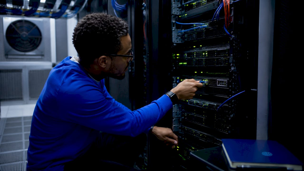 Technician hands setting up server rack