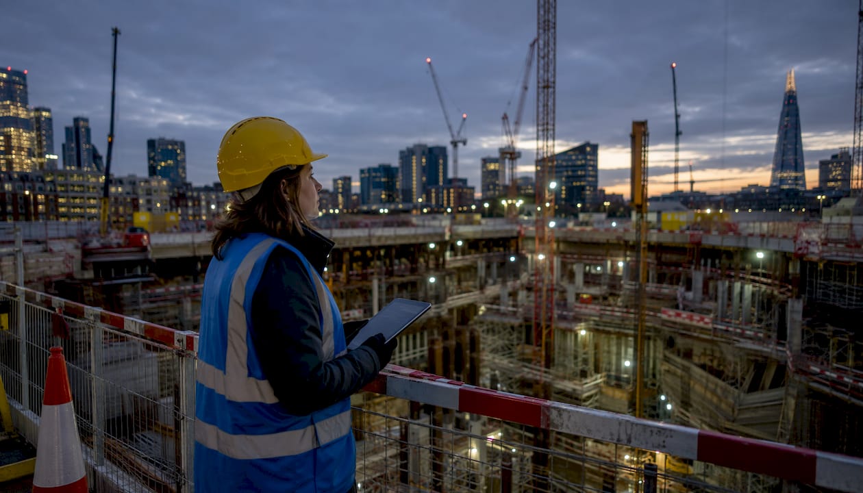 Female engineer inspecting safety on construction site