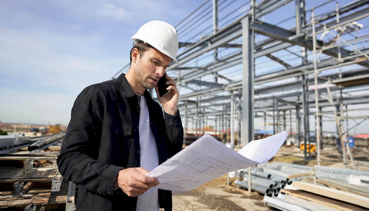 Architect coordinating specialists onsite