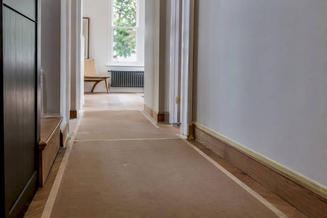 Ram Board floor protection laid in London home hallway