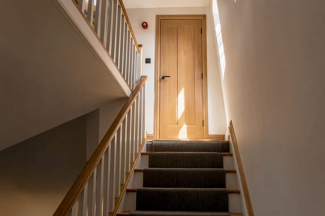 Fire door protecting a loft escape route