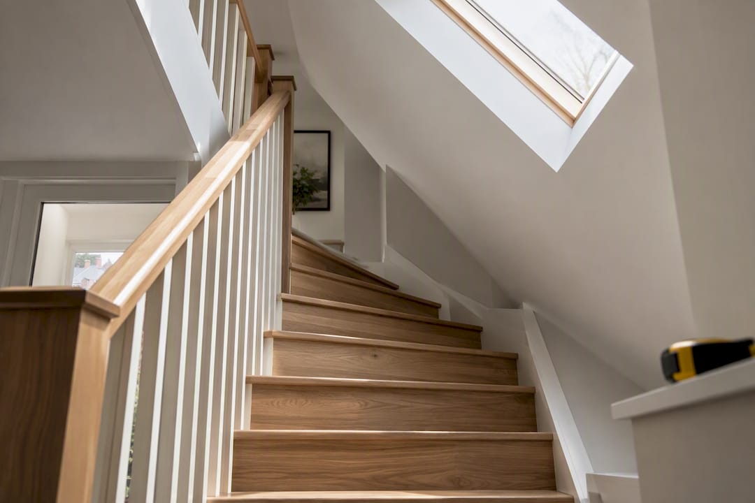 Loft staircase beneath sloping London roof