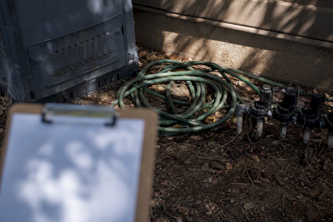Residential garden hose near chemicals inspection