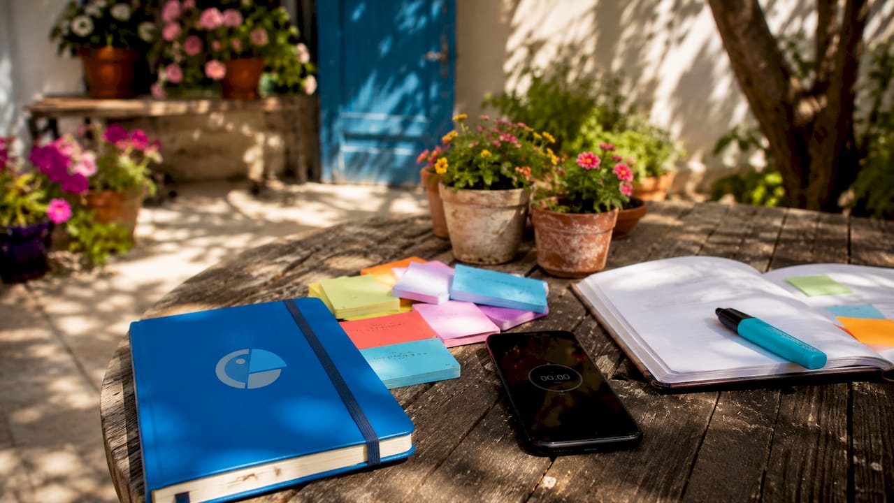 Overhead view of language learning materials on desk