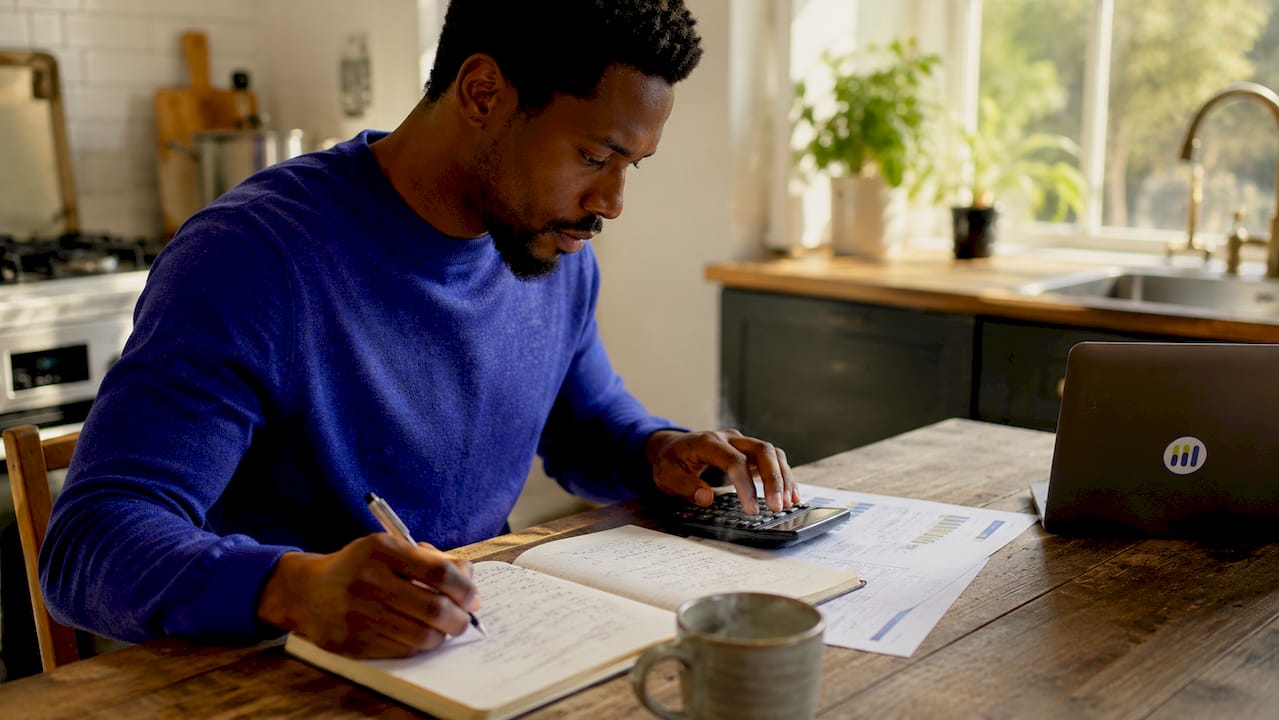 Hands doing DCF stock valuation calculations