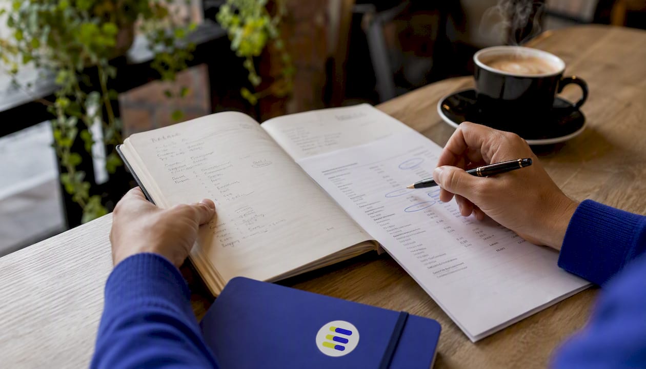 Side view of hands holding income statement paper