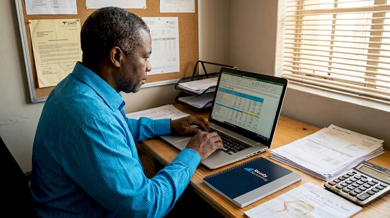 Business owner reviews finances for fraud