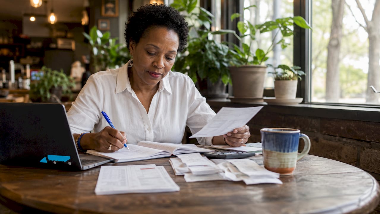 Entrepreneur reviewing SME finances in office