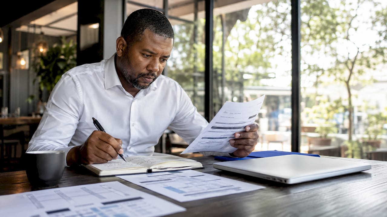 Tax professional reviewing SARS penalty notice