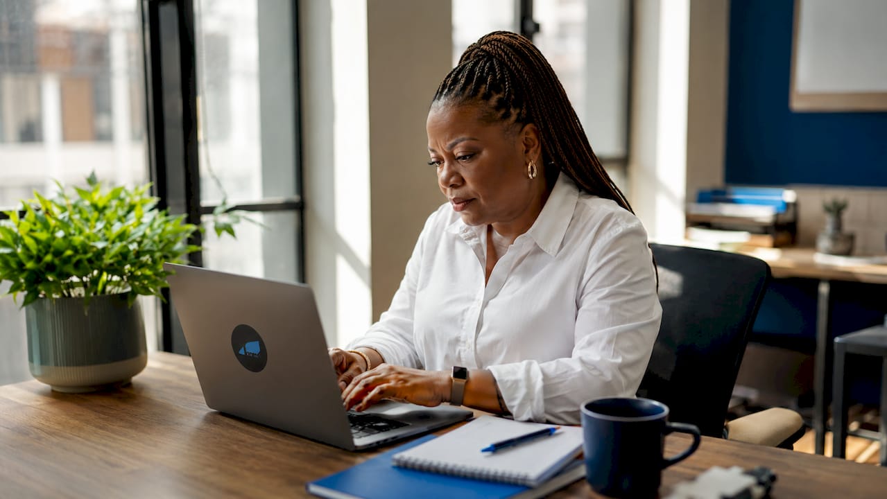 Woman managing multiple companies on computer