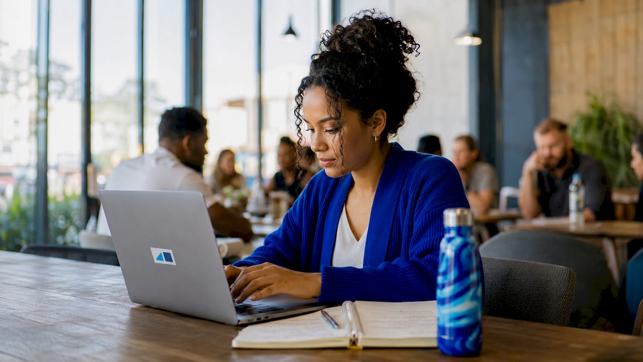 Hands typing on laptop setup customer account