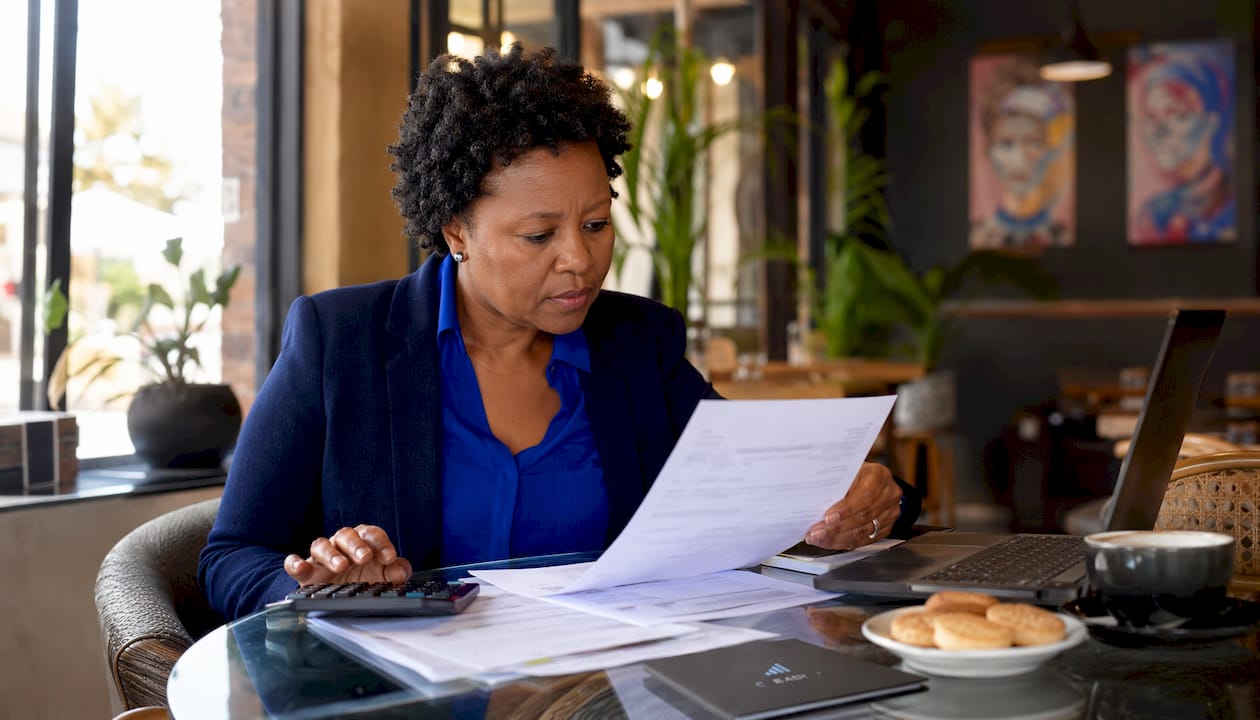 Accountant reviewing tax papers at desk