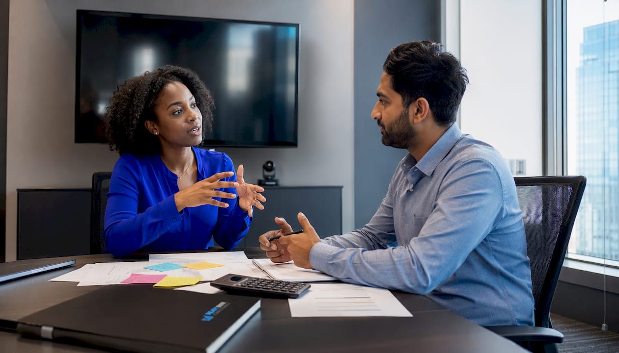 Two people discussing cloud accounting software