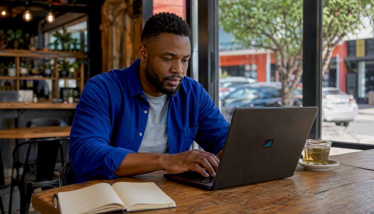 Hands typing payment reminders on laptop keyboard