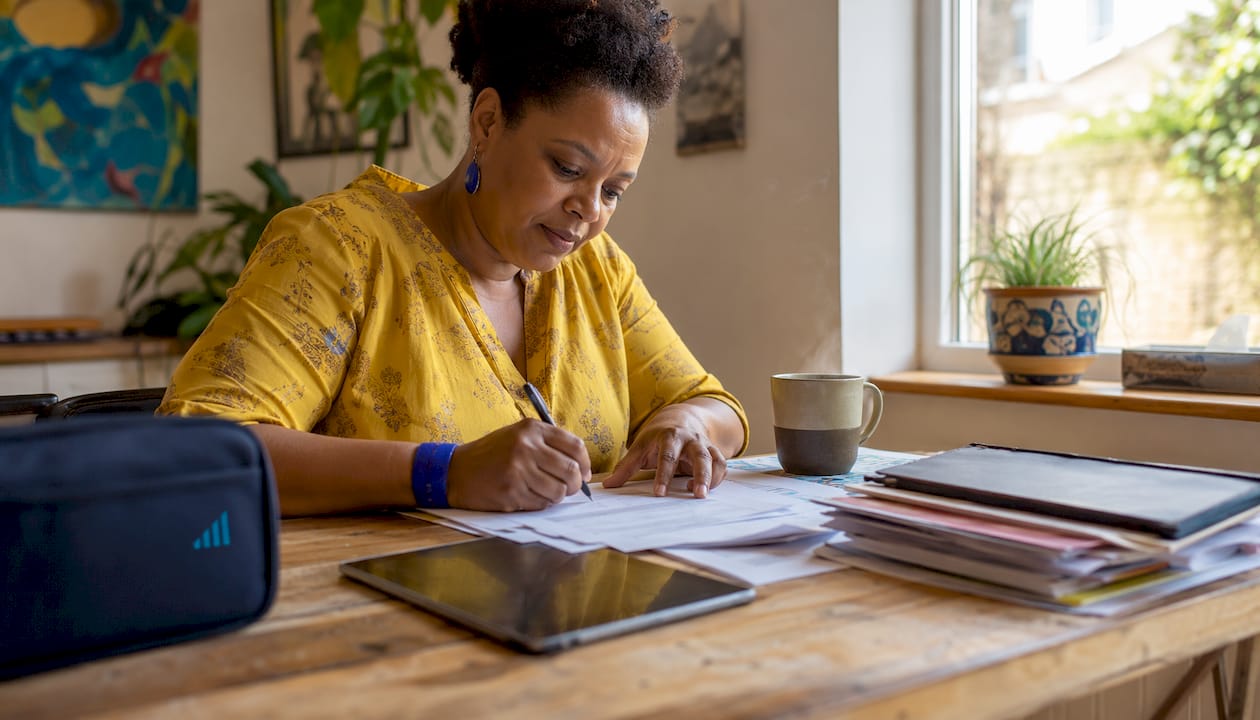 Small business owner completing VAT forms at home