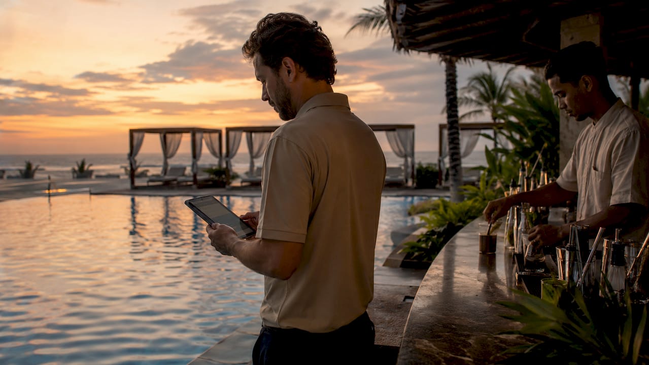 Pool bar manager using digital menu tablet outdoors