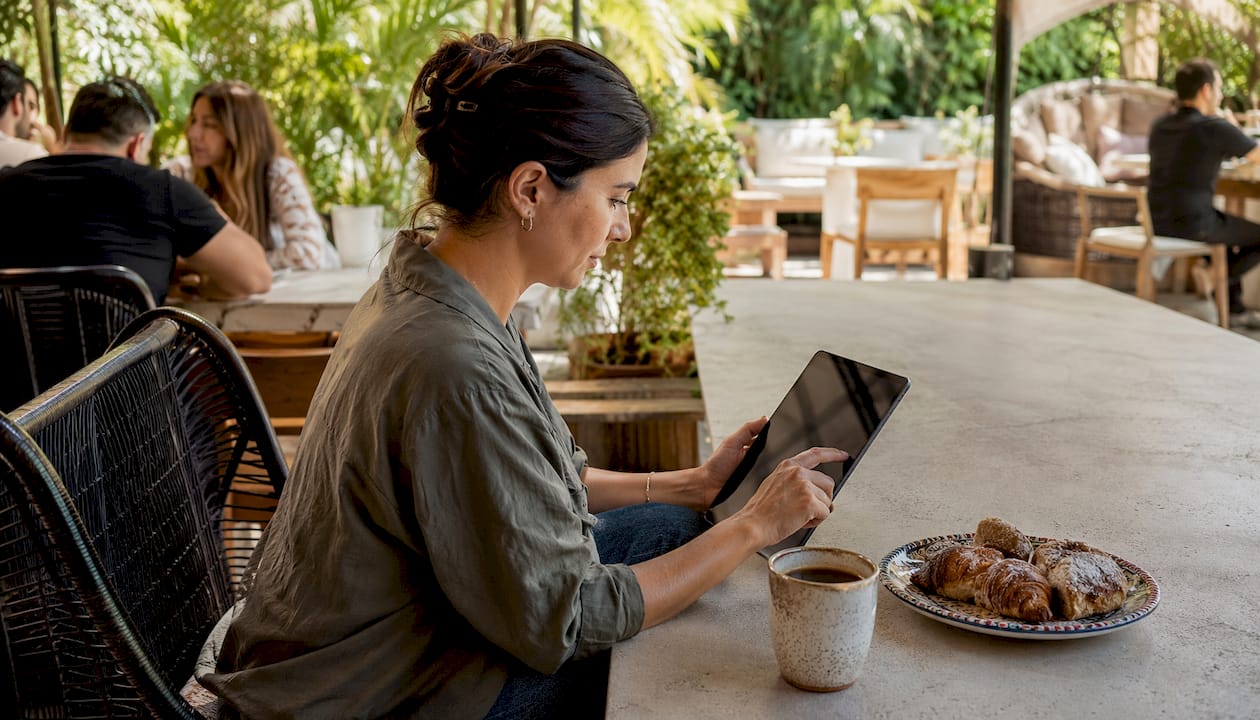Restaurant owner updating digital menu on tablet