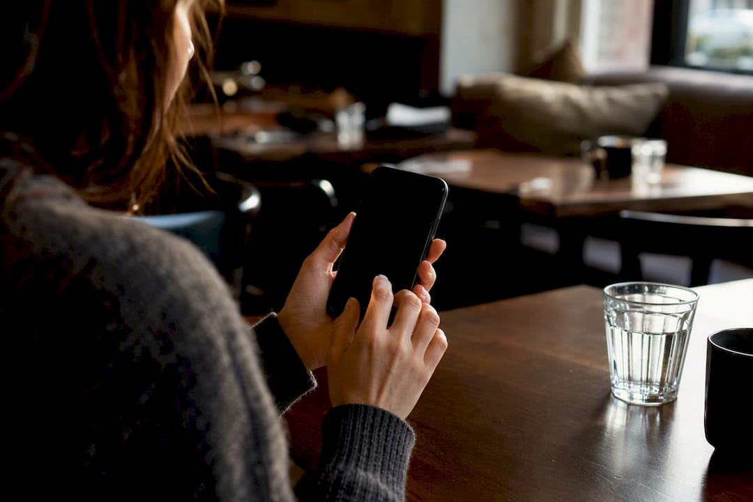 Guest entering login code on smartphone
