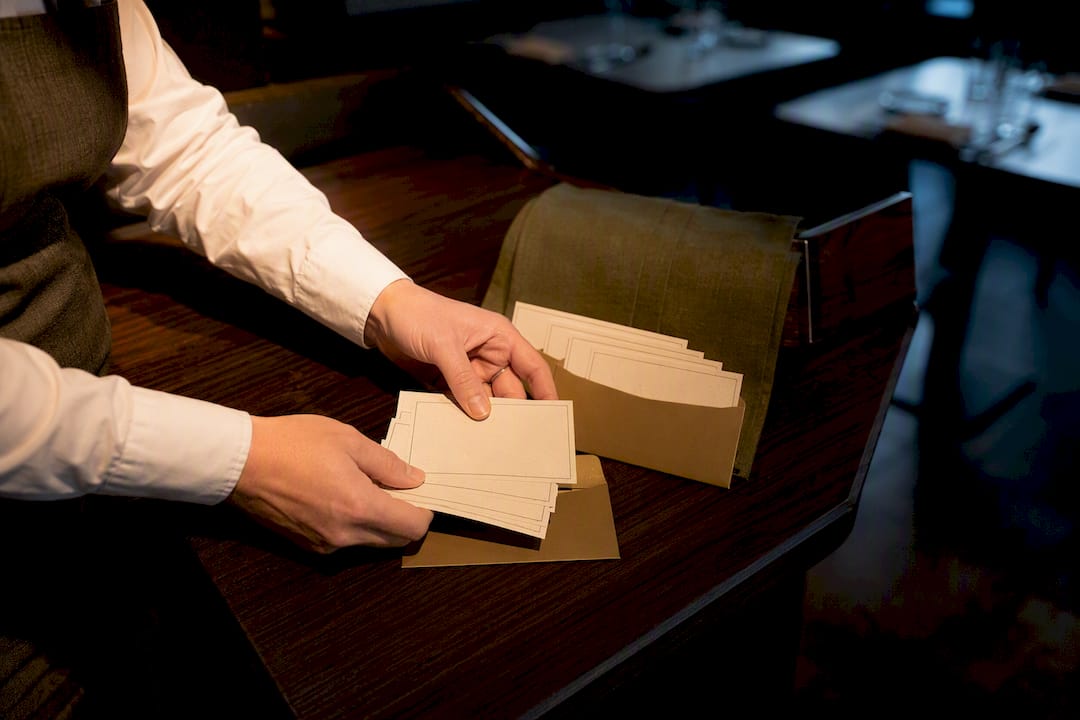 Restaurant manager arranging holiday gift cards
