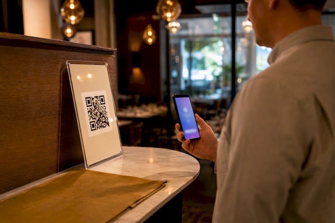 Manager testing laminated QR code scan