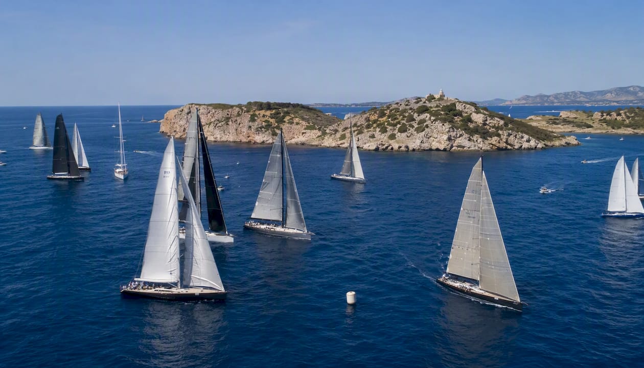 Maxi yachts starting regatta near Porto Cervo shore