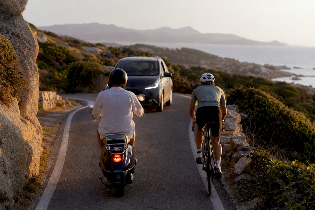 Traffic sharing a narrow Sardinian coastal road