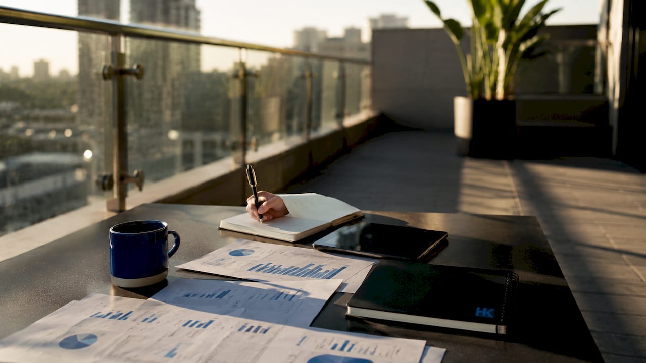 SaaS founder reviewing financial reports at desk