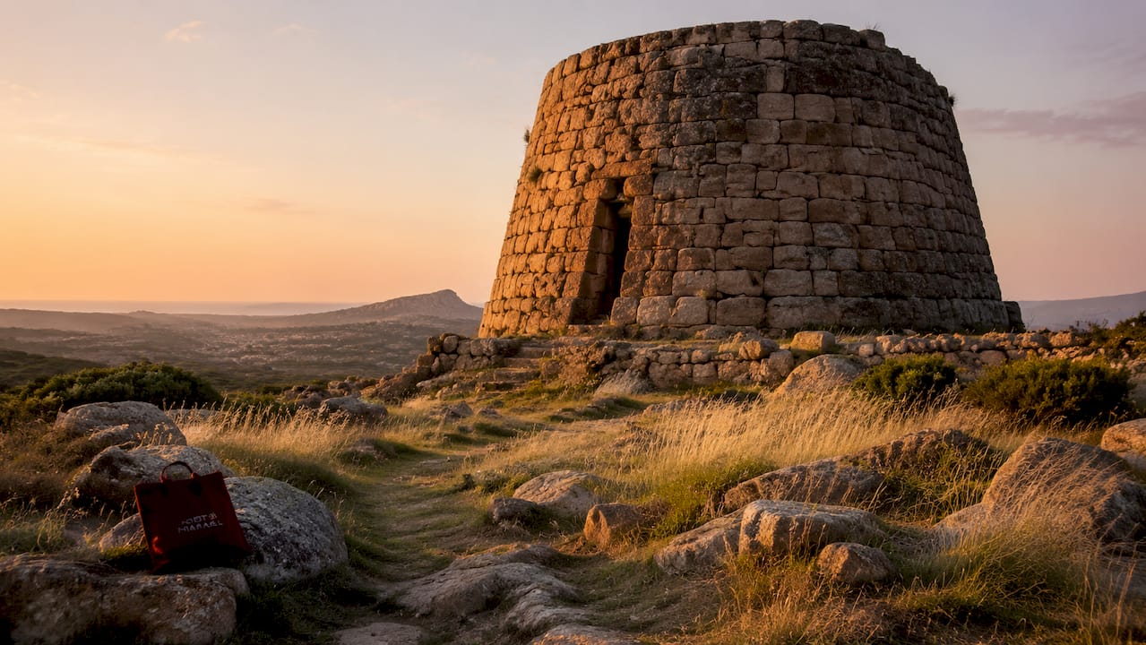 Close view of stone nuraghe tower in bright daylight