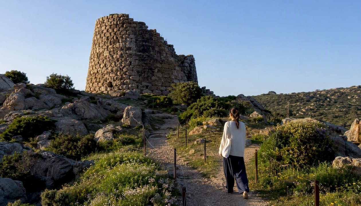 Ancient nuraghi with respectful visitor