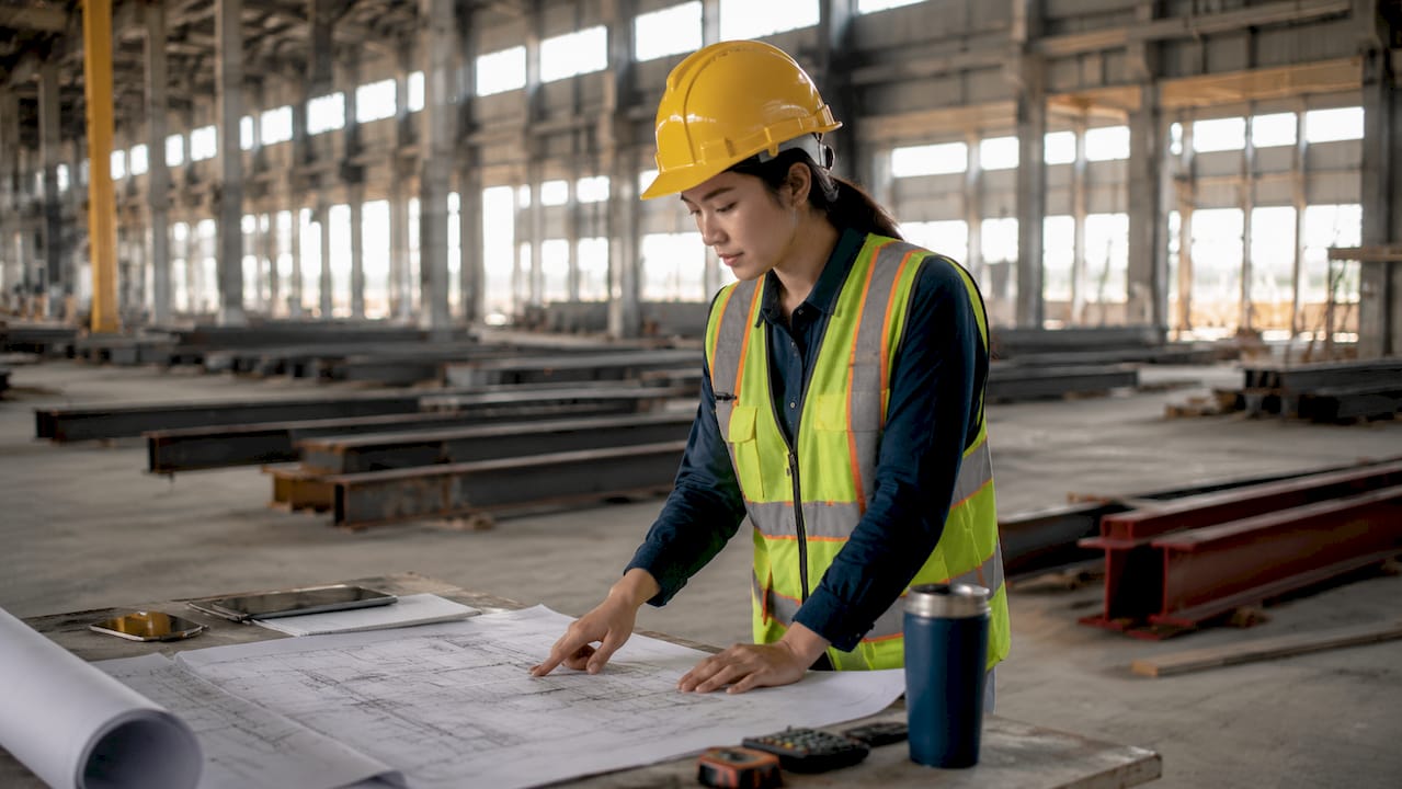 Construction engineer inspecting industrial structural design