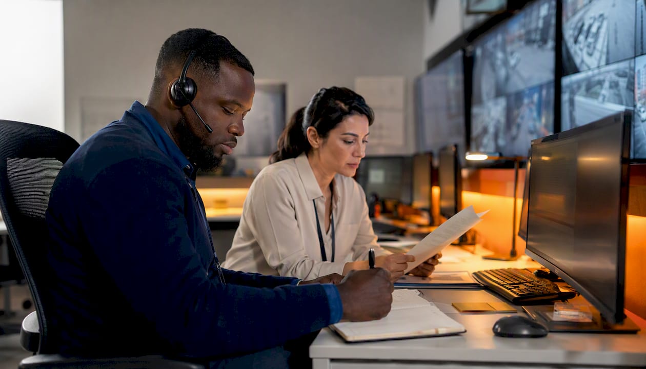 Operators monitoring industrial control room