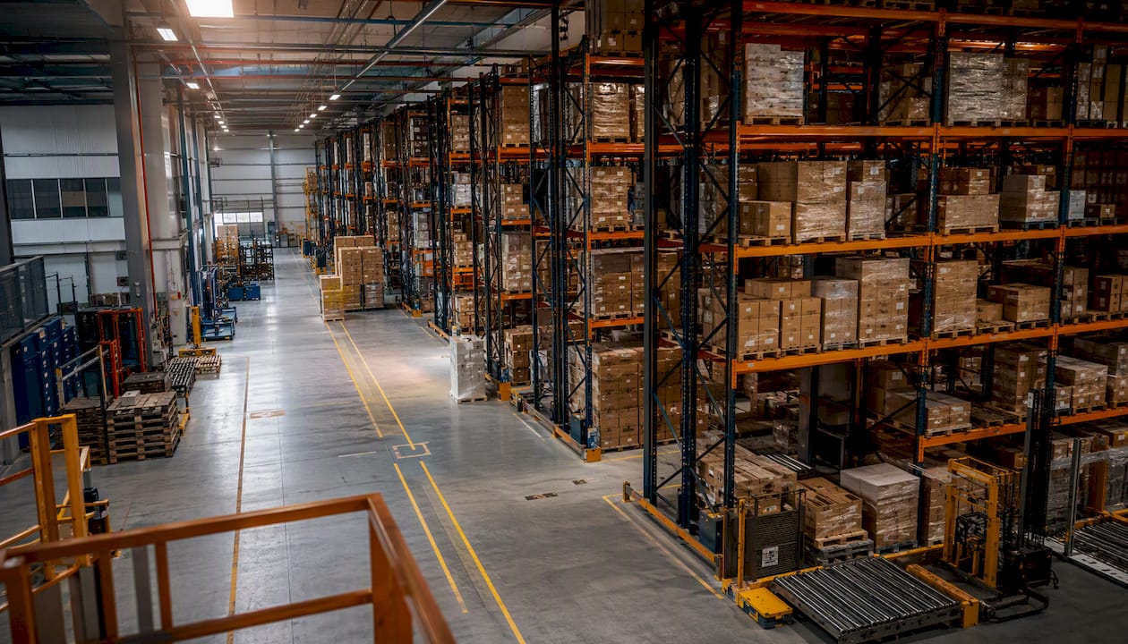 Interior warehouse aisle with pallet racking and columns