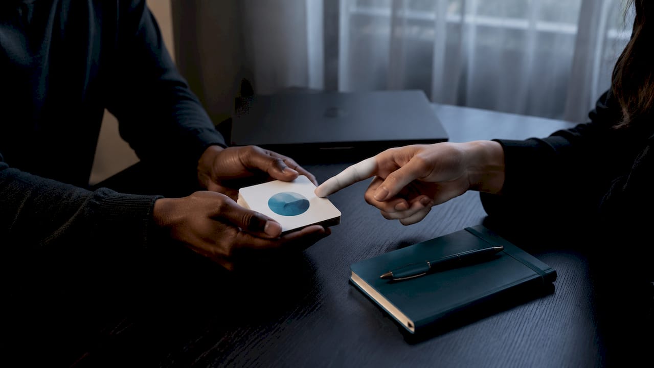 Hands using intimacy communication exercise cards