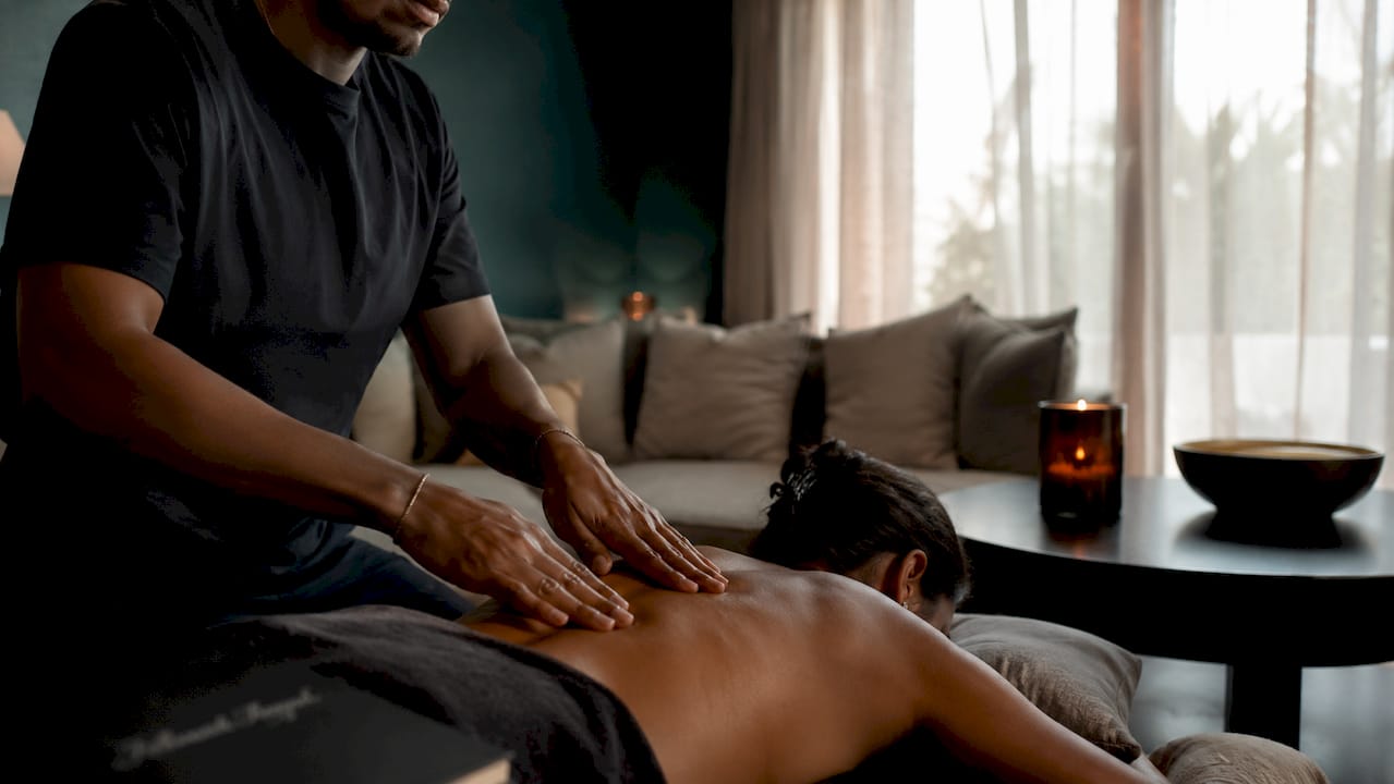 Hands giving sensual shoulder massage