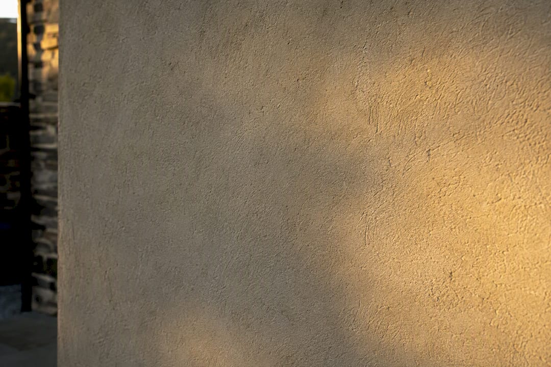 Close-up of cured cementitious render texture
