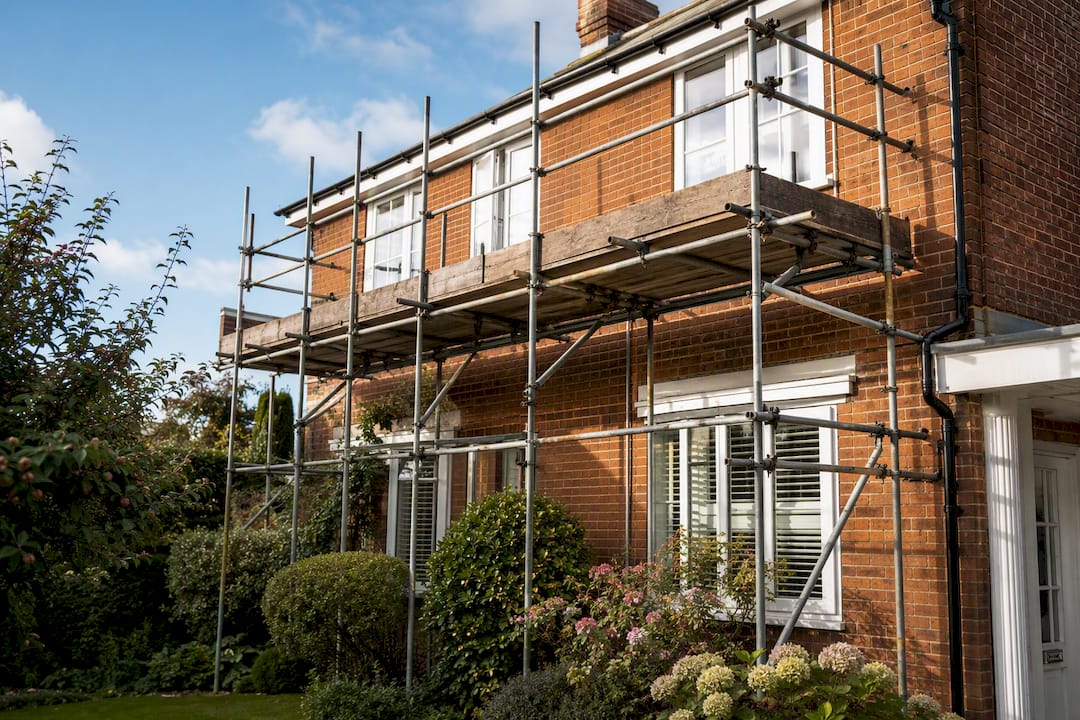 Scaffolding setup around UK semi-detached house