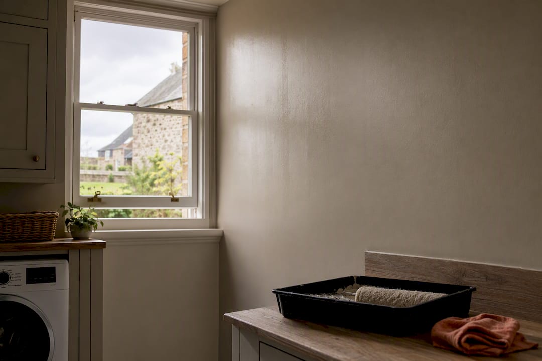 Freshly painted wall beside open window