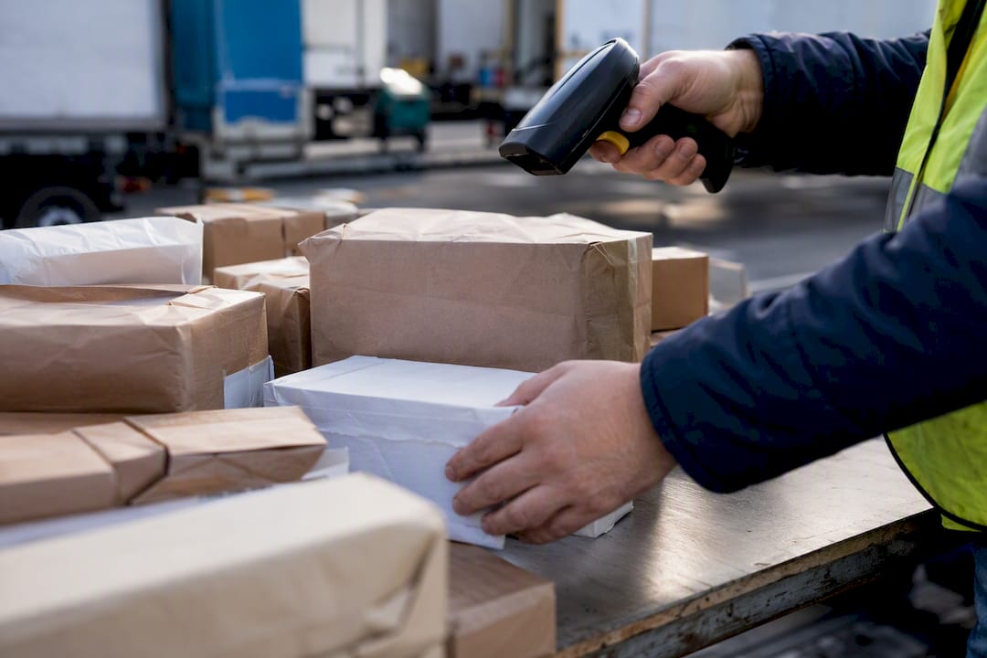 Warehouse hands sorting food supplier boxes