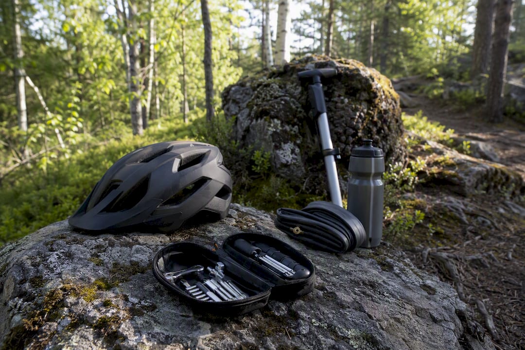 Mountain biking essentials on forest floor