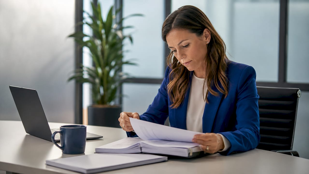 Risk manager reviewing insurance policy documents
