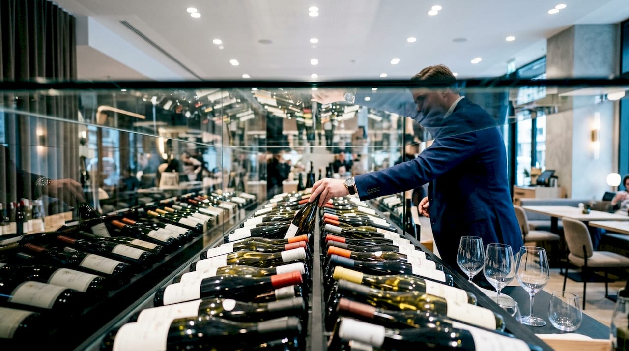 Wine bottles displayed on shop shelf