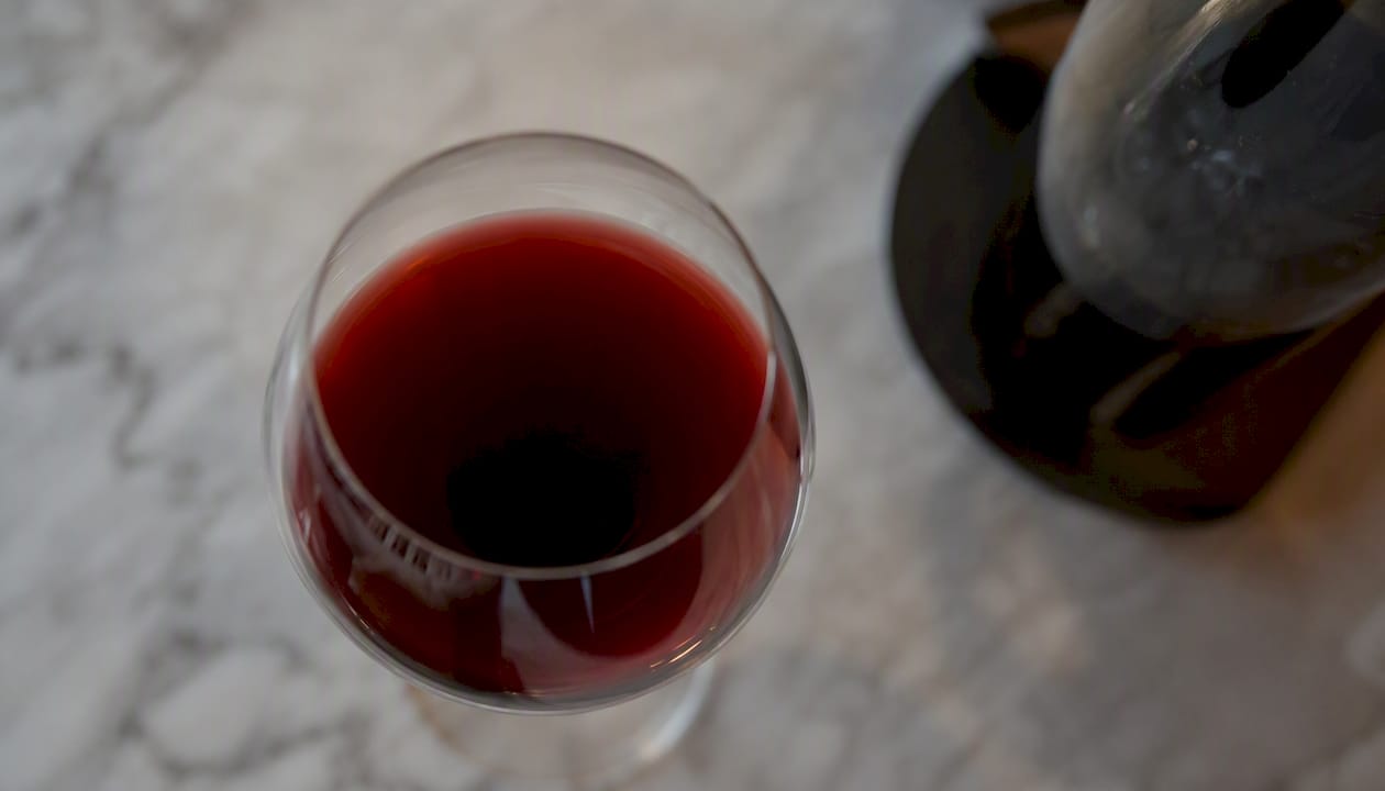 Red wine glass with aging color gradient