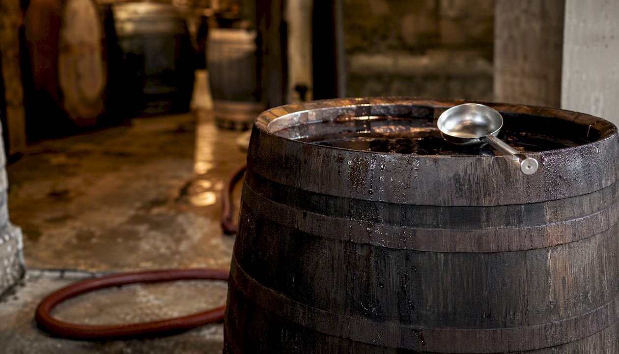 Small oak fermentation barrel in cellar