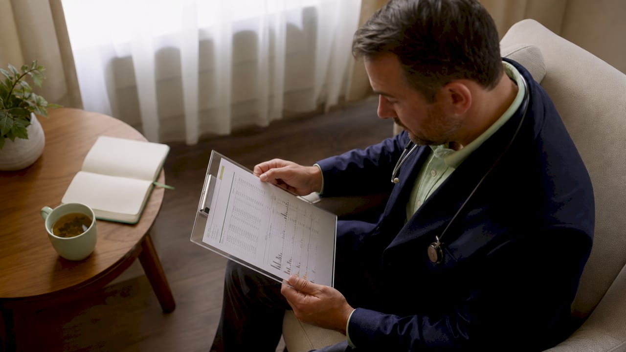 Doctor holding clinical biomarker results clipboard
