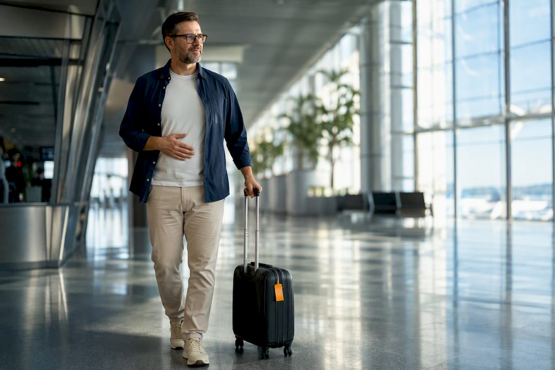 Postoperative traveler walking through airport