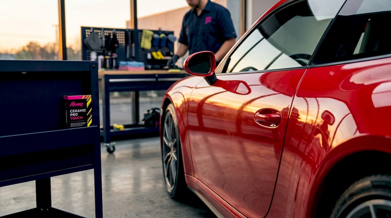 Close-up showing gloss enhanced vs untreated car paint surface