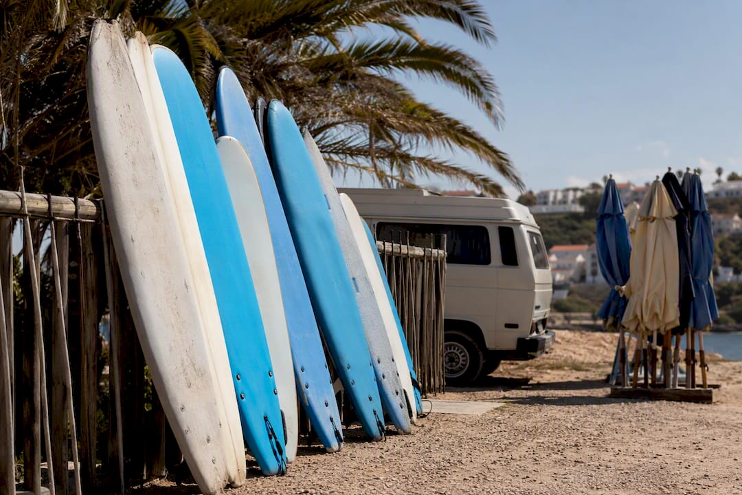 Surfboards stacked at local surf school pickup area